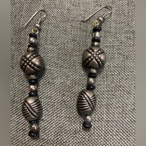 Gunmetal colored & black beads dangle pierced earrings.Approximately 3-1/4”long.